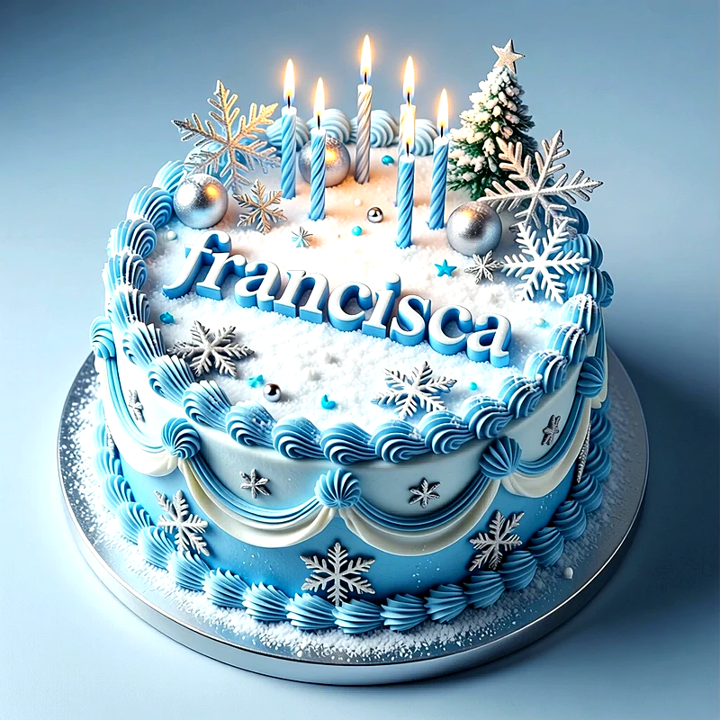 Tarta de cumpleaños azul y blanca decorada con copos de nieve y velas encendidas, con el nombre Francisca escrito encima.