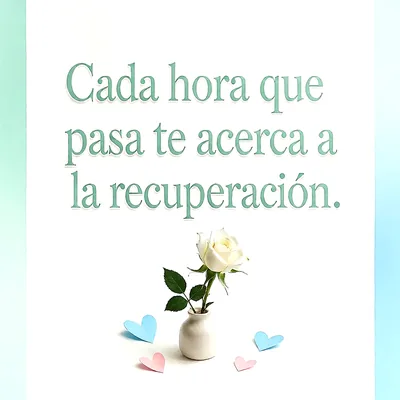 Una rosa blanca en un jarrón pequeño rodeada de corazones de papel en tonos pastel sobre fondo blanco, con un mensaje de esperanza en letras verdes.